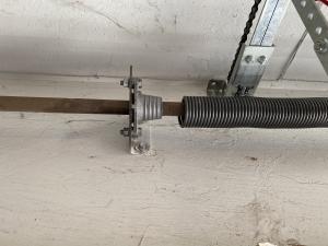 Close-up of a garage door spring
