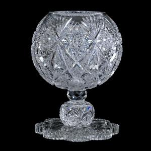 Two-piece American Period Cut Glass pedestal rose globe in the Kensington pattern by Hawkes, 10 ¾ inches tall, impressive in size, weighing 11 pounds. Estimate: $4,000-$7,000