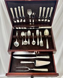 The sterling silver set shown here is typical for a set handed down in families. The choice to sell or obtain a secured loan is offered by The Jewelers Coin & Loan Co. Some customers have a sentimental attachment, so a simple secured loan may be preferable to a sale.