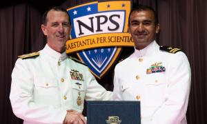 Pictured during graduation in June 2019 with then Chief of Naval Operations Adm. John Richardson, U.S. Navy Lt. Cmdr. Zishan Hameed with his thesis partner U.S. Marine Corps Capt. Josh Gats focused their patented research on improving radiation detection.