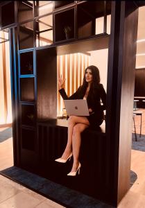 British Entrepreneur Nadia Alexander-Khan composed in conference in business attire in UK Head Media Offices