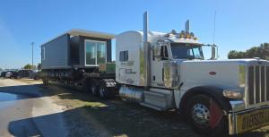House boat being transported.
