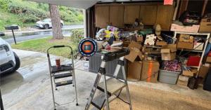 On The Spot technician performing a professional garage door spring repair at a residential home in Belmont Shore, Long Beach.