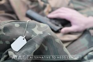 Close-up of a military service member wearing camouflage with dog tags visible, symbolizing veterans coping with PTSD and seeking mental health support.
