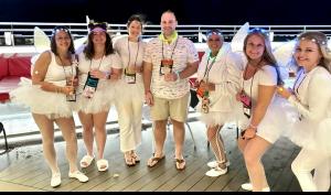 Dental professionals celebrate team spirit at Smiles at Sea, the premier destination-based CE cruise experience known for its immersive learning and unforgettable fun.