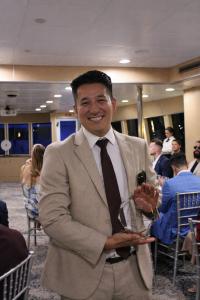 Modementum founder Blake Welle receiving the Most Improved Business Leader award during the Miami leadership retreat ceremony.