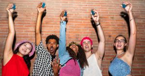 Image of teenagers holding a shot of liquor in the hands