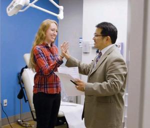 Dr. Suh evaluates thyroid patient