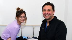 Shriners Children's Dr. Branski meeting with young burn patient.
