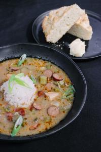 Chef Serge Krikorian's signature gumbo served with cornbread, both featured during his THV11's The Vine appearance ahead of the Saline County Shindig on February 7, 2026. Photo by Vibrant Occasions Catering.