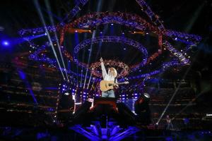 One-of-a-kind specialized stage hoisted from the ceiling as the band kicks off half-time at the Houston Rodeo