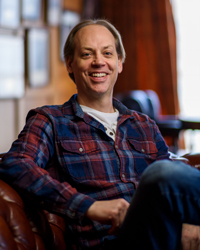 A head shot of Craig Elliott in the Writers & Illustrators of the Future lounge in Hollywood