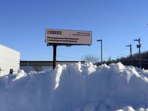 One of many billboards around Pittsburgh displaying WESA local news headlines.