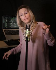 Singer-songwriter Leah Soderblom, known artistically as Leayh In Light, recording in her home studio.