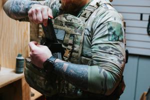 Phone being placed in a SLNT x Haley Strategic Faraday Wedge