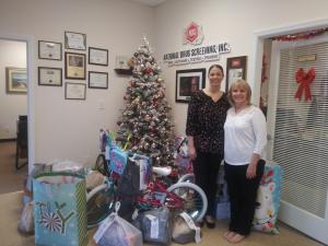 Julie Floriano and Shannon Kikendall coordinator of the NDS Christmas Giving Team