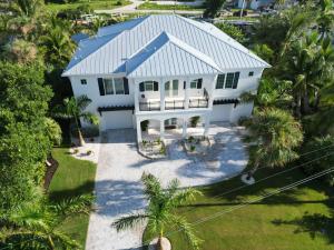 Exterior of a residence with roof by Gulf Western Roofing. The company is opening a new Port St. Lucie branch, providing residential roofing services on Florida's East Coast..