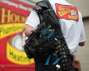 An Any Hour technician arriving with tools.