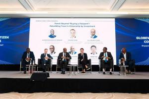 Panel discussion on Citizenship by Investment at Globevisa Global Citizen Conference 2025 in Singapore, featuring Globevisa CEO Henry Fan and government representatives on stage.