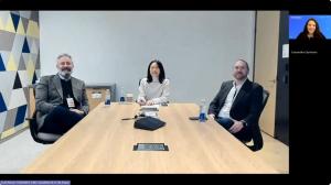 Screenshot of the Empower 2026 fireside chat session showing two panelists and the moderator seated in a meeting room and the and the host joining via video, captured during the discussion on nonprofit AI journeys.