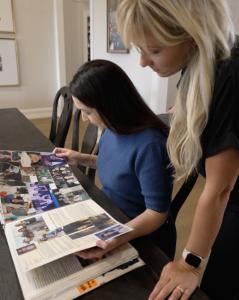Director Rebecca Hodges and Executive Producer Elizabeth Forrest on set, looking through a scrapbook.