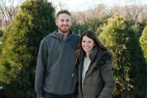 Matt and Rachel Stine pause to smile for the camera on their Indiana Christmas Tree Farm.