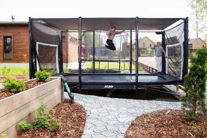 Rectangle Trampoline ACON X in Garden with 2 children playing