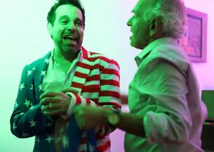 Mario Cantone Wearing American Flag Jacket