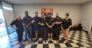 Open Sesame branded service van parked outside a home, representing top-rated repair services in Las Vegas and Summerlin.