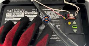 A professional technician installing a security-reinforced garage door opener in a West Carson (90745) residence.