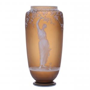 Circa-1890 English cameo art glass vase signed George Woodall, marked Thomas Webb and Sons, 8 ¼ inches tall, with a raisin-colored background and white cameo carved overlay. Estimate: $15,000-$20,000