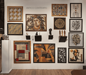 Antico Contempo booth wall at the SALON NY Art + Design Fair, featuring a large grid of colorful contemporary mosaics displayed closely together, creating a richly textured, museum-like installation view.