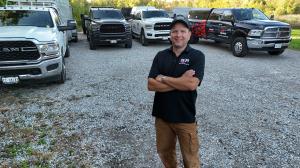 The RJR Demo & Junk founder standing in front of their truck in Ajax.