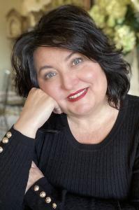 Stephanie Mason author headshot wearing black sweater with red lipstick professional portrait photo