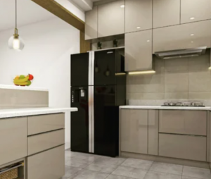 Modern high-gloss taupe kitchen cabinetry with integrated lighting and a black refrigerator, showcased by the premier wholesale kitchen cabinet center in Las Vegas.