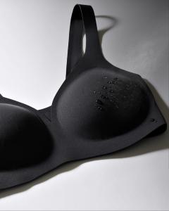 Black Huug Invisible Plunge bra with water droplets.