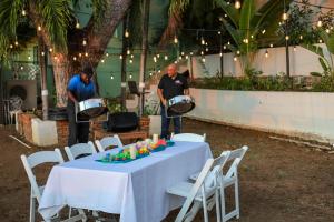 Small outdoor gathering with live music at a boutique hotel event space in St. Thomas