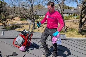 Mother Modern Plumbing's Master Plumber prepares for hydro jetting service with equipment in Dallas