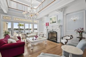 Hand-Carved Carrara Marble Fireplace & Murano Chandeliers