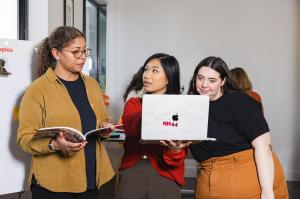 Creative Repute team members reviewing digital content and strategy together on a laptop during a collaborative working session.