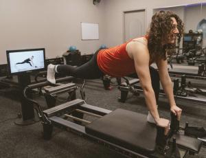 A Well Studio member using the KioskPro by Your Reformer in Dublin, California