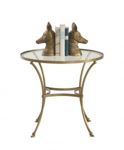 round glass top side table with books and fox head book ends at Ballard Designs.