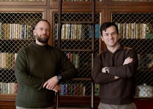 Hardshell's founders stand together in the University of Virginia library