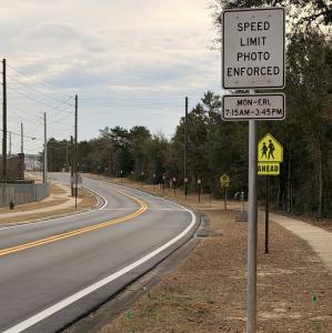 sign on the road the says Photo enforced.