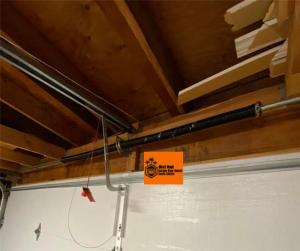 High-cycle torsion spring replacement on a garage door, showcasing emergency repair services in Valencia, CA.