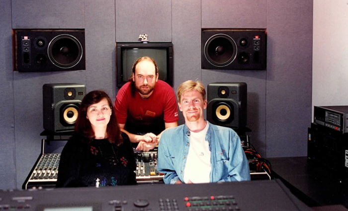 3 people in a music studio setting