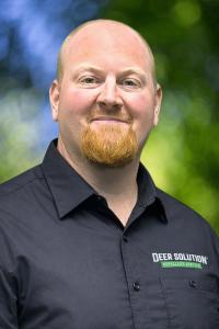 Brian Lee, Dir. Training and Support at Deer Solution Franchising and owner of Deer Solution of New Hope in his Deer Solution uniform