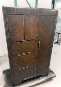 Timeless elegance redefined. This armoire features a rich dark walnut finish with stunning chevron patterns, blending Art Deco glamour with modern functionality. Hand-restored by Lanciano Furniture artisans.