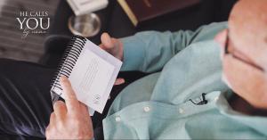 Jim Barnes reading a copy of He Calls You By Name personalized Christian devotional with customized Scripture.