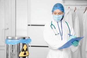 Lab technician with clipboard in lab